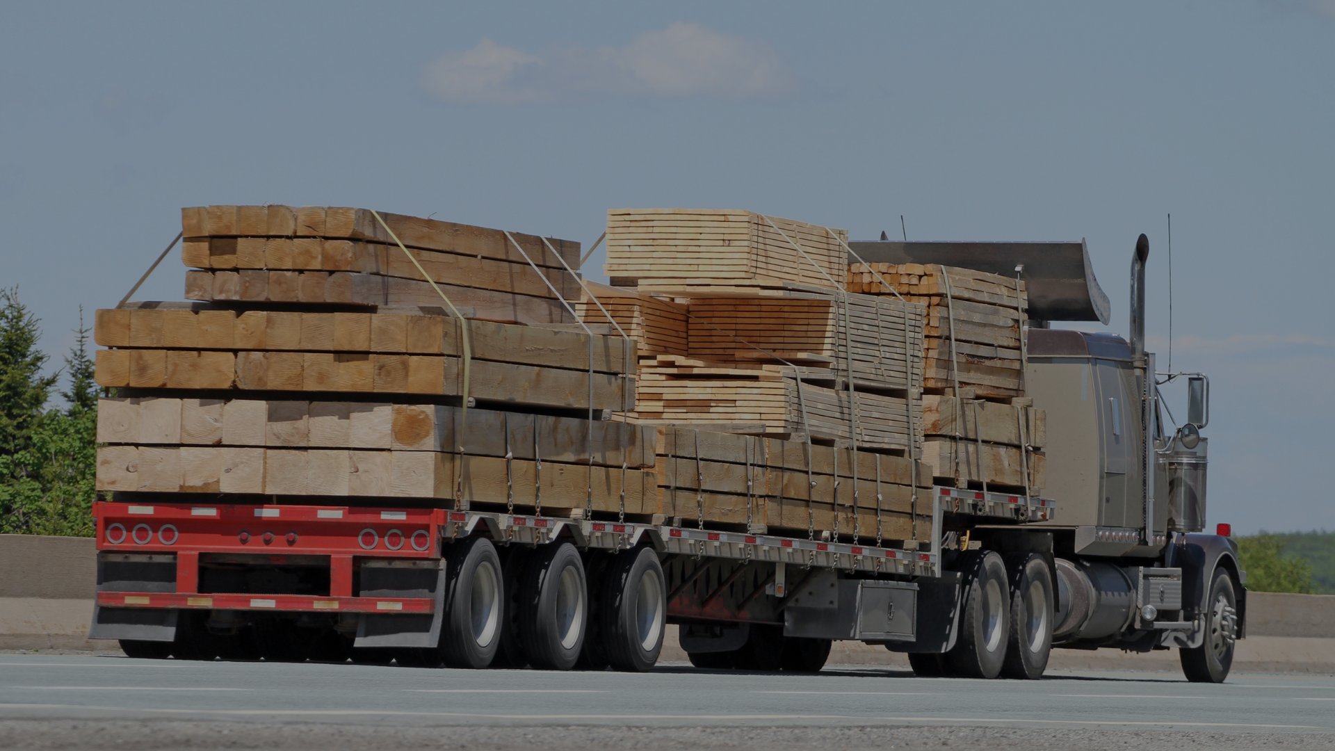 truck delivering various lifts of lumber